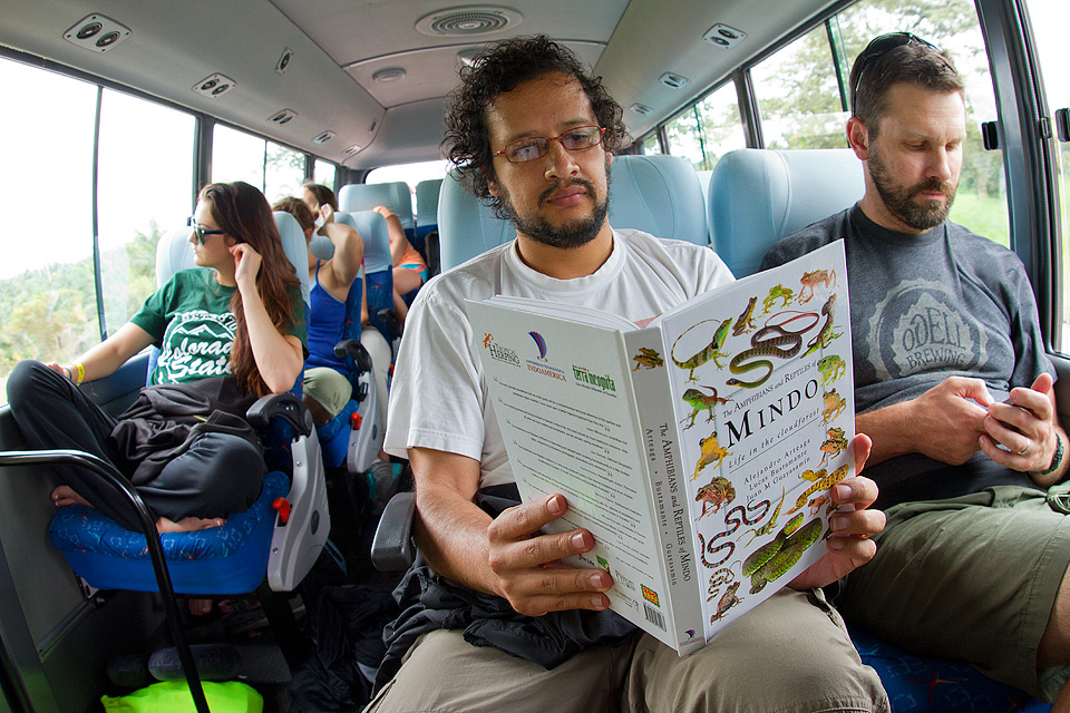 Researcher Juan Guayasamin reads the book Amphibians and Reptiles of Mindo