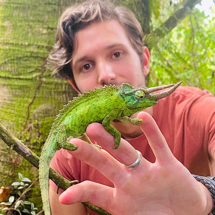 Alejandro Arteaga holding a Jackson’s Chameleon